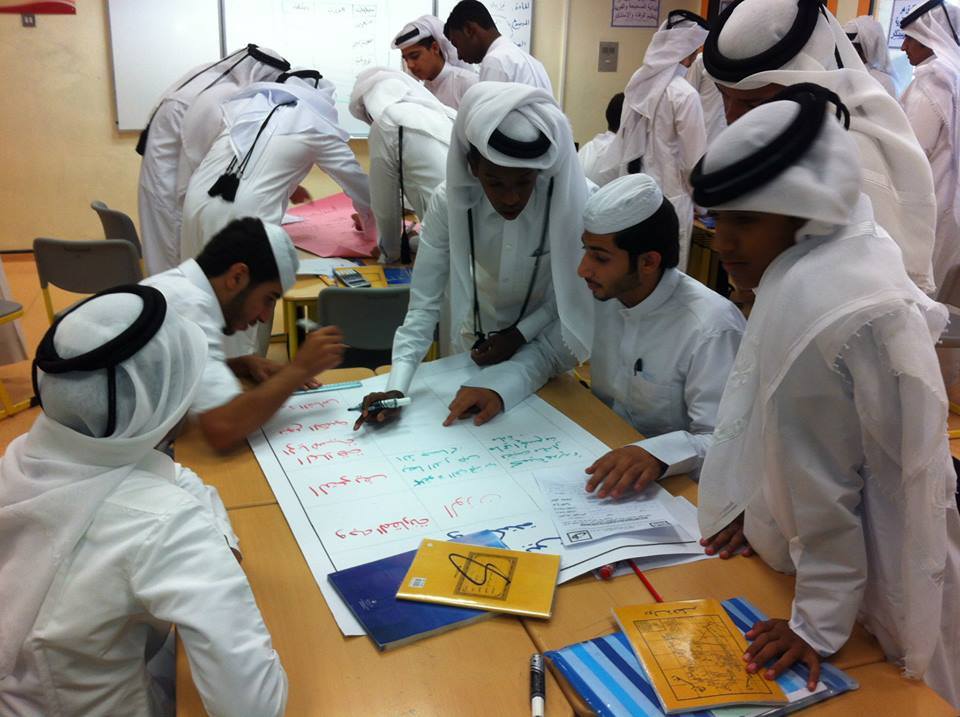 Ahmed Gomaa guiding students through a collaborative physics activity